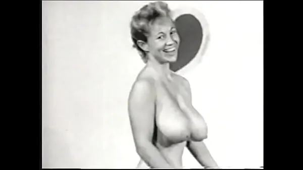 Big Nude model with a gorgeous figure takes part in a porn photo shoot of the 50s fine Movies